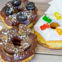 Fancy Donut · Regular donut with chocolate vanilla or white icing with a cereal topping mini oreos gummy b...