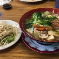 Hu Tieu Chay · White rice noodles in clear veggie broth, with slim cuts of tofu, mushroom, broccoli, sesame...