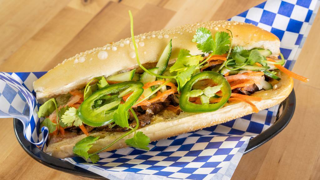 Banh Mi/Sandwich · Protein choice, house-made egg mayo/pate spread, cucumber, cilantro, jalapeños, pickled carrots/daikon.