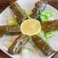 Grape Leaves · 6 Seasoned grape leaves stuffed & rolled with rice & spices