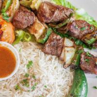 Lamb Kabob · 1 skewer of marinated lamb pieces with onions, peppers, side of salad & rice