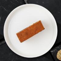 Classic Tiramisu · A slice of classic Italian dessert.