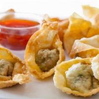 Fried Wontons · Deep fried wonton wrapped with ground chicken or shrimp served with sweet and sour sauce.