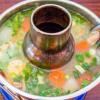Seafood Soup · Hot and sour soup with combination seafood, lemongrass, and mushroom.