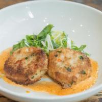 Crab Cakes · two crab cakes served with cabbage slaw, citronette, dill remoulade