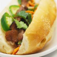 Grilled Pork Sandwich · French baguette bread, mayonnaise, cucumber, mixed pickle daikon & carrot, cilantro & jalapeno