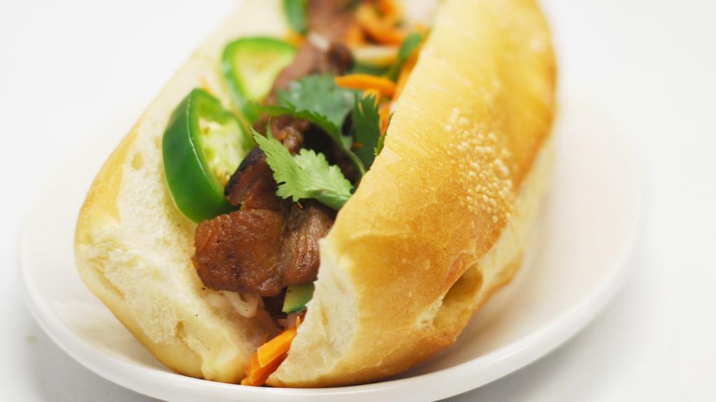 Grilled Pork Sandwich · French baguette bread, mayonnaise, cucumber, mixed pickle daikon & carrot, cilantro & jalapeno