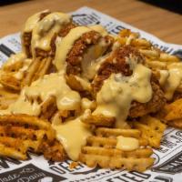 She'S Nacho Chick · Our Crispy Golden #Fries Topped with a Side Chick and covered with Hatch Chile Cheese Sauce