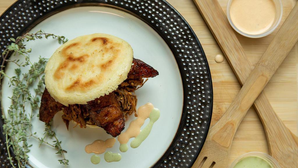 Pabellon Arepa · White corn bread with black beans, fried plantains, shredded beef sauteed with onions and spices. The Pabellon is the National Dish from Venezuela. It will be your favorite.