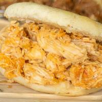 Chicken Arepa · A white cornbread shell filled with rich combinations of Chicken