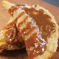 2 Sweet Empanada  · 2 filled with dulce de leche and apricot. Contain gluten