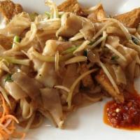 Drunken Noodles · Stir-fried wide rice noodles with spicy chili sauce, basil leaves and bean sprouts, onion.