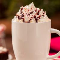 Peppermint Hot Chocolate · Peppermint Hot chocolate topped with whipped cream chocolate sauce and candy cane pieces.