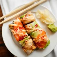 Magic · Spicy tuna topped with salmon, yellowtail, avocado, crunchies, tobiko.