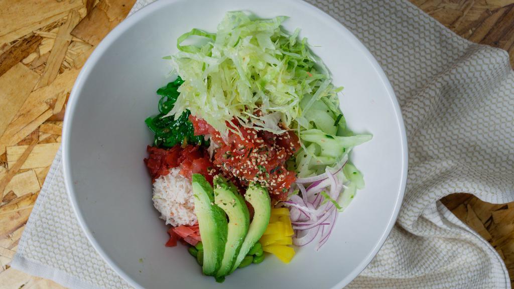 Tuna Poke Bowl · Tuna, sushi rice, crab salad, cucumber, avocado, sweet pickled radish, seaweed salad, edamame, pickled red ginger, dried seaweed, lettuce, red onion carrot.

Contains raw fish.
Consuming raw or undercooked meats, seafood, shellfish or eggs may increase your risk of food borne illness.