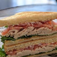 Turkey Sandwich · 1/4 lb. Turkey, green leaf, Roma tomato, red onion, and mayonnaise. Your choice of bread. Se...