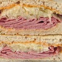 Meyer Lansky Sandwich · 1/4 lb. Pastrami, sauerkraut, Swiss, and Russian dressing. Served hot on toasted Jewish rye ...