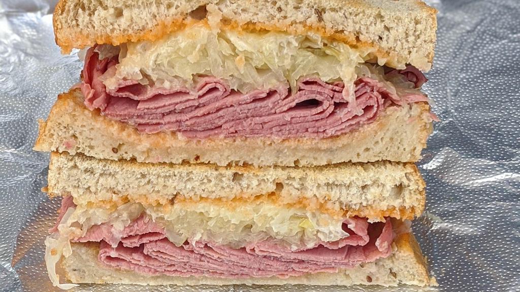 Meyer Lansky Sandwich · 1/4 lb. Pastrami, sauerkraut, Swiss, and Russian dressing. Served hot on toasted Jewish rye bread. Served with a pickle spear.