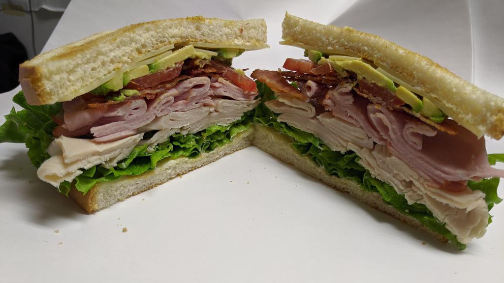 Jack Dragna Club Sandwich · 1/4lb. Turkey, 1/4 lb. smoked ham, bacon, avocado, Swiss, green leaf, Roma tomato, red onion, and mayonnaise. Your choice of bread. Served with a pickle spear.