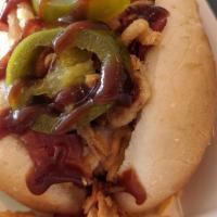 Cowboy Dog · Shredded Monterey Jack cheese, chopped bacon, fried onions, jalapenos, and BBQ sauce. Proudl...