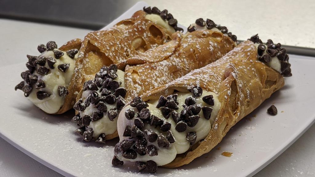 Cannoli · Italian pastry with a light flakey fried shell, filled with sweet creamy Ricotta and Mascarpone cheese and chocolate chips, lightly dusted with powdered sugar. From Viro's Real Italian Bakery right here in Tucson!