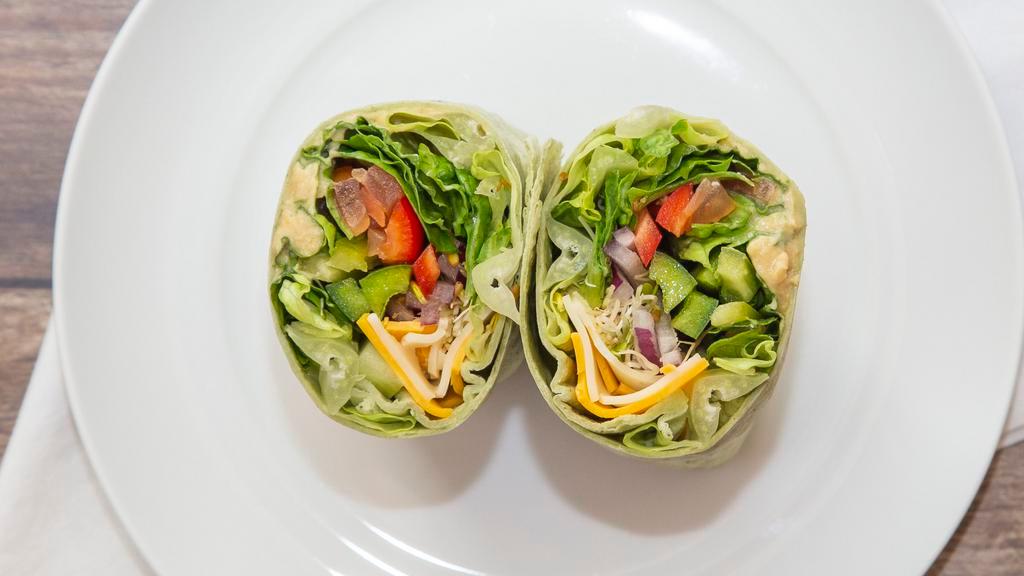 Garden Fresh Wrap · Swiss and Cheddar cheeses, hummus, cucumber, red and green bell pepper, lettuce, tomato, red onion, alfalfa sprouts, olive oil and vinegar on our spinach tortilla.