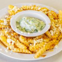 Greek Fries · French fries covered with feta cheese, oregano, and olive oil, served with a side of with ou...