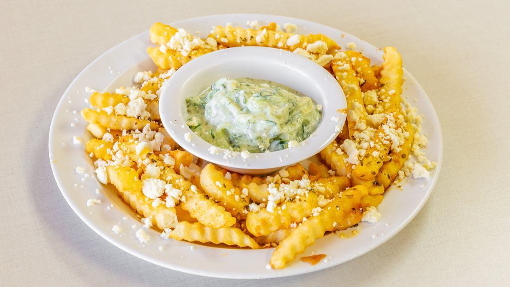 Greek Fries · French fries covered with feta cheese, oregano, and olive oil, served with a side of with our house tzatziki sauce.