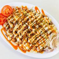 Chicken Shawarma Plate · Chopped marinated chicken in our own special blend of shawarma spices.  Served with rice or ...