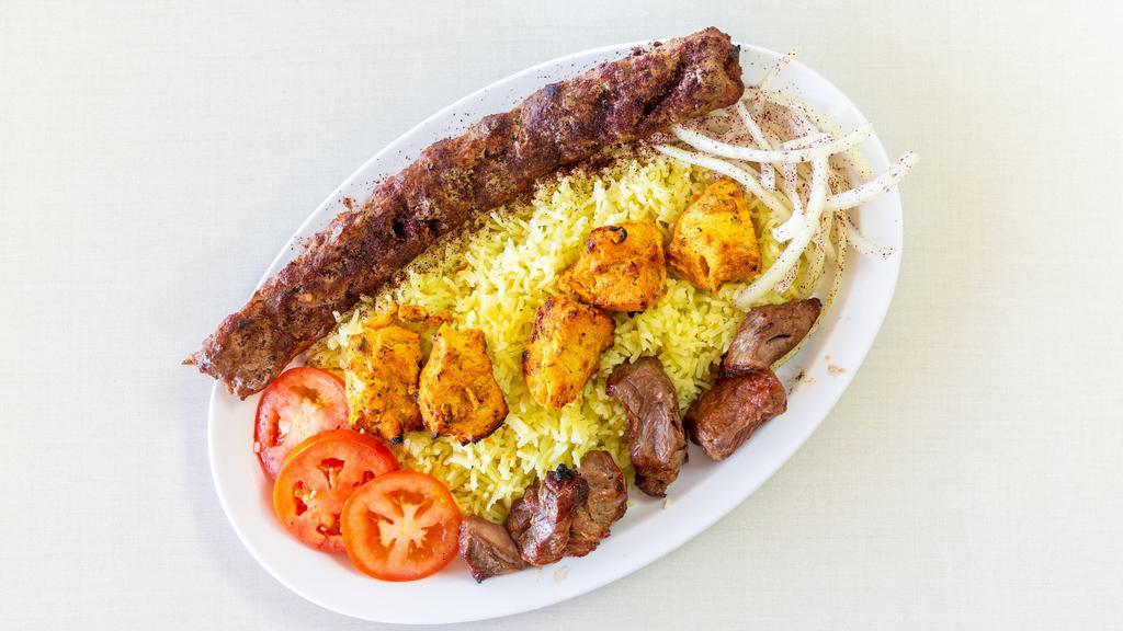 3 Meat Combo · A skewer of seasoned ground beef, a skewer of a marinated chicken and a skewer seasoned rib eye steak or lamb, char-broiled to perfection. Served with rice, fresh slices of tomatoes and onions, pita bread and garlic sauce.