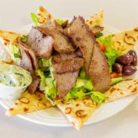 Gyro Plate · Slices of rotisserie gyro meat. Served with rice, fresh slices of tomatoes and onions, pita ...