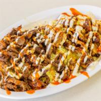 Beef Shawarma Plate · Chopped marinated beef in our own special blend of shawarma spices. Served with rice or sala...