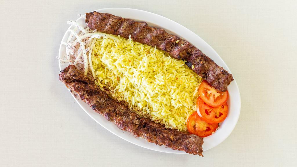 Kafta Kebab · Two (2) skewers of seasoned ground beef, char-broiled to perfection and served with rice, fresh slices of tomatoes and onions, pita bread and garlic sauce.