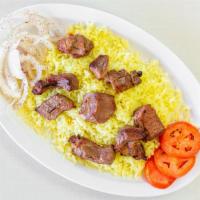 Beef Kebab · A skewer of seasoned rib eye steak char-broiled to perfection, served with rice, fresh slice...