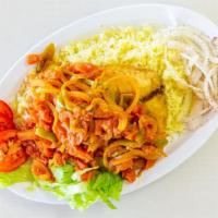 Fish · Marinated tilapia, deep-fried and topped with our own special sauce. Served with rice, fresh...