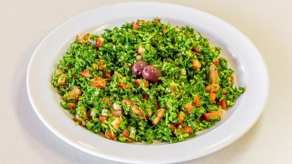 Tabbouleh · Diced parsley, tomatoes, onions and couscous tossed in our very own house dressing.