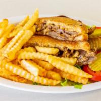 Gyro Panini · Slices of rotisserie gyro meat with grilled onions and American cheese, served with a side o...