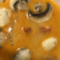 Tom Kha Gai · Coconut soup with chicken, mushrooms, onion, tomato, lemon grass, lime leaves and Thai spice...