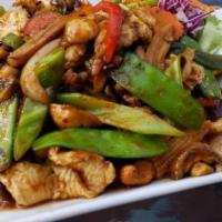 Cashew Chicken · Mild spicy. Sliced chicken stir fried with roasted cashew nuts, mushrooms, onions, carrots, ...