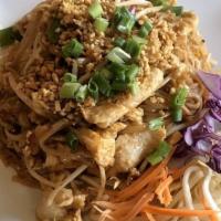 Phad Thai · Mild spicy. Thai rice noodles stir fried with egg, ground peanuts, green onion and fresh bea...
