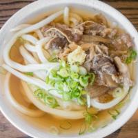 Niku Soup · Hand-made udon noodles served in our signature dashi broth. Topped with savory sukiyaki beef...