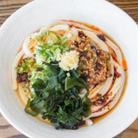 Tan Tan Sauce · Hand-made udon noodles lightly dressed with our signature dashi soy sauce. Topped with spicy...