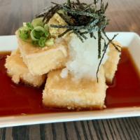Agedashi Tofu · Four pieces of crispy fried tofu with grated daikon radish, grated fresh ginger and sliced n...