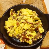 Meaty Scramble · Sausage and bacon scramble. Served with toast or an English muffin.