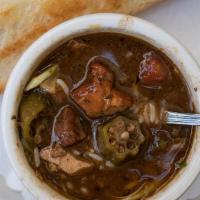 Cup Of Gumbo · Dark roux stew w/ smoked chicken, andouille sausage & trinity, topped w/ rice & green onions