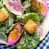 House Salad · Crispy head lettuces tossed in buttermilk-blue cheese dressing w/ bacon crumbles, pickled re...