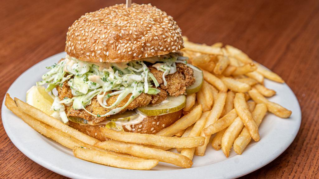 Fried Catfish Sandwich · Cornmeal dusted crispy-fried Catfish on a griddled sesame bun w/ lemon slaw, dill pickles, & Crystal hot sauce mayo. Served w/ a side of french fries.