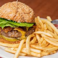Griddle Burger · 6oz Painted Hills patty w/ bacon, American cheese, pickles, lettuce & parmesan aioli on a to...
