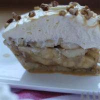 Ban-Offee Pie · Shortbread & pecan crust filled w/ caramel & bananas
 topped w/ whipped cream