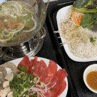 Bo Nhung Dam (Beefsteak In Vinegar Hot Pot) · For two persons. Come with rice paper for wrapping and a platter of fresh lettuce, noodles, ...